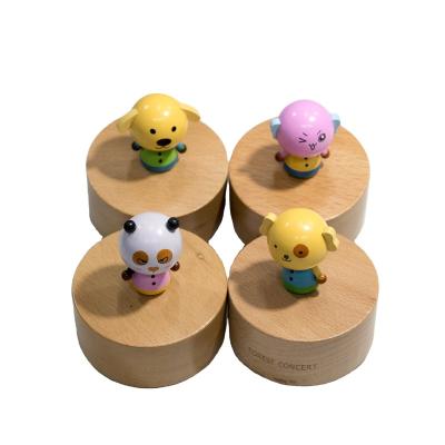 China Wholesale Cartoon Round Shape Music Gift Hand Crank Wood Table Rotating Mechanical Music Box Mini Musical Box for sale