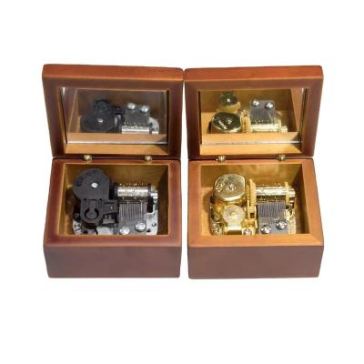 China Popular Wooden Melody Hand Crank Gift with Mirror Laser Engraved Wood Crank Music Box for sale