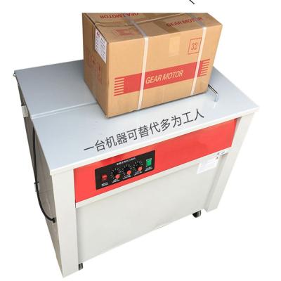 China Carton strapping packing cheap price table type semi-automatic pp belt strapping machine for carton box packing for sale