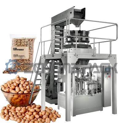 China Peanut Rice Packaging Machine Multifunctional High Speed Multi-Station Vacuum Packaging Machine for sale