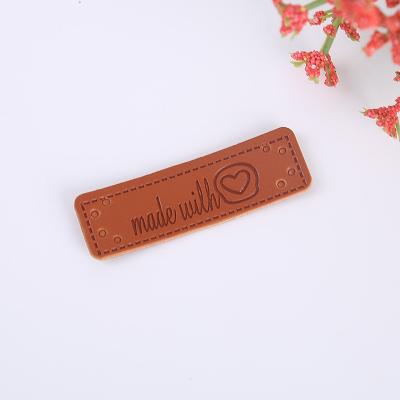 China Sustainable High Quality OEM Logo PU Tag Leather Hat Patch Custom alloy Genuine Leather Label for Jeans Clothes Bags for sale