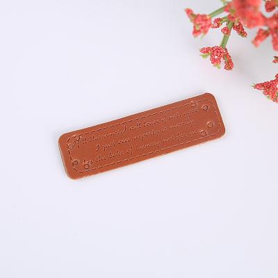 China Sustainable Fashion Design Custom Brand Name Logo Embossed PU Faux Leather Labels and Patches for Jeans and Sofa for sale