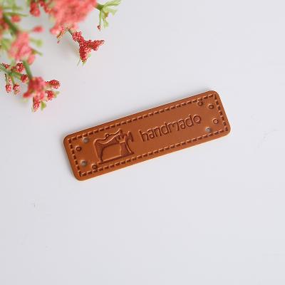 China Sustainable Customize Hat pu Leather label Patches Embossed and Deboss Leather Patches Logo Sew On Clothing for sale