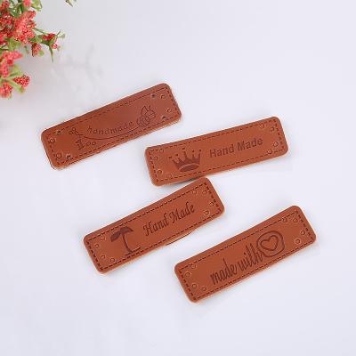 China Sustainable custom high quality brand logo embossed ultrasuede faux soft suede leather labels for garment for sale