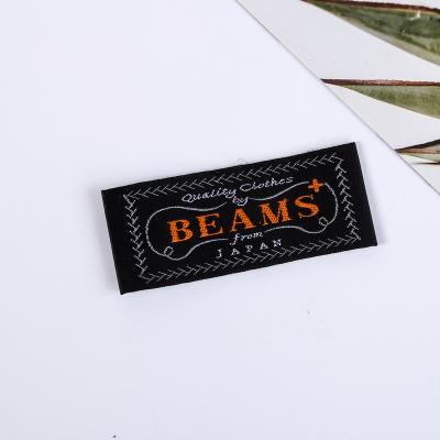 China Sustainable Custom Clothing Sewn Logo Stitching Name Garment Woven Label for Textile Products for sale