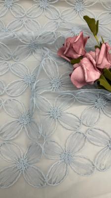 Chine 100% Nylon largeur complète de haute qualité Tissu de broderie en treillis de couleur bleu clairTissu durable parfait pour la mode printemps et été à vendre