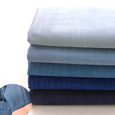 China Organic wholesale blue cotton washed jeans denim fabric for pants shirt skirt sewing accessories for sale