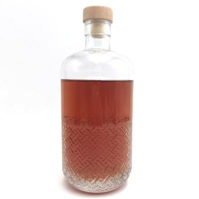 China Excellent Wine Quality Clear Glass Bottle With Ornate Body For Vodka Whiskey Gin for sale