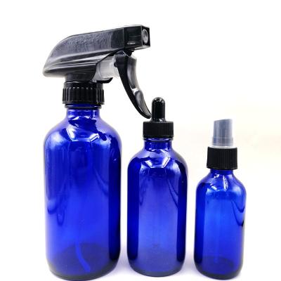 China Personal Care 60ml 2oz Blue Amber Clear Round Boston Glass Dropper Bottle With Dropper Cover for sale