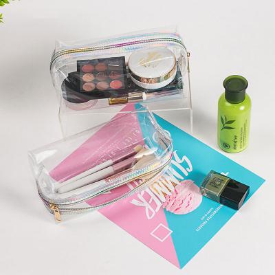 China 2023 Summer Waterproof New Phantom Laser Transparent Makeup Bag Portable Three Piece Travel Storage Bag Wash Bag for sale