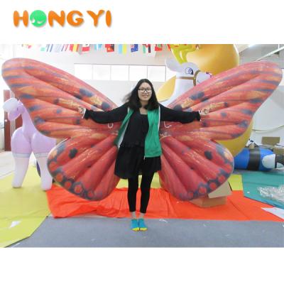 China Custom Event PVC Inflatable Wings Costume Artificial Party Led Inflatable Butterfly Wings For Club Decoration for sale