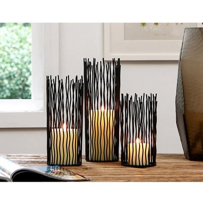 China Morden Eco-friendly Metal Copper Black Hollow Out Gift Home Candlestick Christmas Candle Holder Decor Items Decorative Candlestick Holder for sale