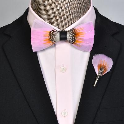 China Fashionable Christmas Brooches Feather Style Wholesale Adjustable Straps Pink Feather Bow Tie for sale