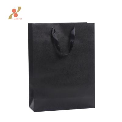 China Recyclable Wholesale Usable Custom Kraft Paper Shopping Bag for sale