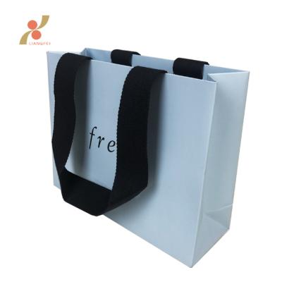 China Shop Recyclable Custom Cosmotic Product Packaging Art Paper Bag for sale