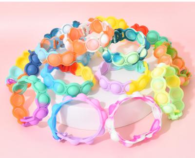 China Relaxation Soft Squeeze Rainbow Silicone Kids Fun Push Bubble Noise Bracelet Moving Person Sensory Toys for sale