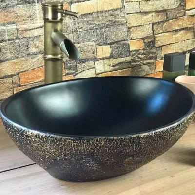 China F-033 Modern High Quality Bathroom Cement Sink Black Gold Painted Round Ceramic Art Wash Basin for sale