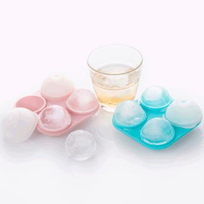 China Viable 4 Hole Sphere Ice Molds Silicone Bar Ice Hockey Whiskey Ice Cube Maker Custom Ball Trays Mold Freezing for sale