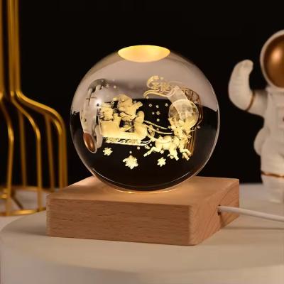 China Engraved 3d Laser Crystal Ball With LED Lighting Wooden Base Crystal Ball Souvenir for sale