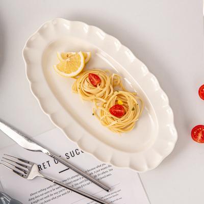 China Platos largos Platos ovales de cerámica moderna para restaurantes Conjunto de vajilla de porcelana nórdica en venta