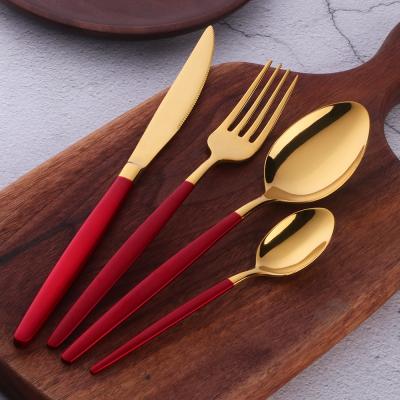 China Sustainable Gold Color Stainless Steel Flat Dinnerware Set With Chinese Red Coating Handle for sale