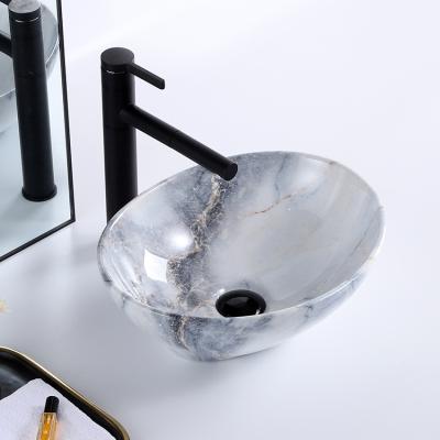 China Modern Unique Modern Oval Bathroom Sink Basin Art Dining Table Top Art Ceramic Marble Hand Basin zu verkaufen