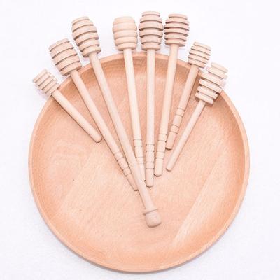 China Customizable Natural Engraved Wooden Bee Honey Stirrer Stick Teaspoon Dipper From Europe for sale