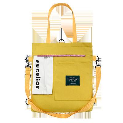 China Fashion 2021 ready to ship retro college student handbag class canvas casual shoulder backpack dual-use tote bag for sale