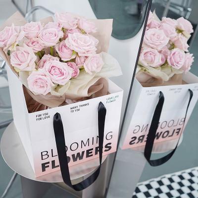 China Recyclable Wholesale Custom Flower Gift Portable Paper Bag for sale