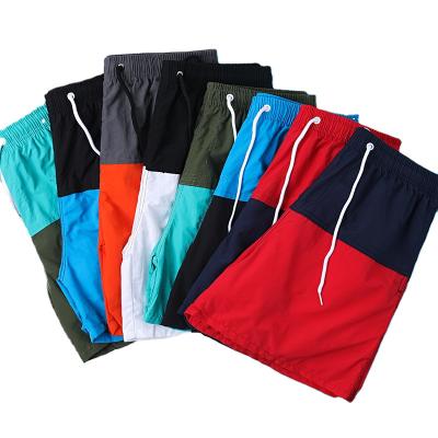 China Waterproof Anti-Wrinkle Stock Men's Outdoor Quick Dry Running Workout Shorts Summer Casual Beach Customized Spandex Bermuda Shorts for sale