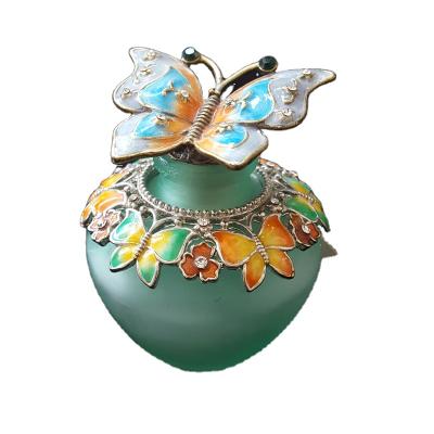 China Wholesale Dubai Butterfly Shape Stocked Colorful Luxury Relief Perfume Oil Bottle for sale