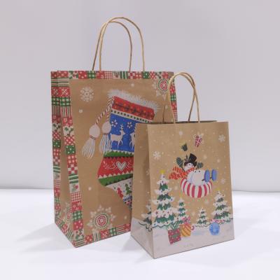 China Recycled Brown Materials Eco Kraft Paper Bag Christmas Package Printed Customized Gift Bags for sale