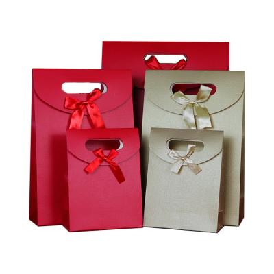 China Wholesales Eco Friendly Recyclable Packaging Supplies With Ribbon Wedding Party Custom Logo Gift Bag for sale