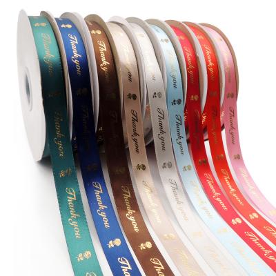 China Custom single face polyester ribbon printing gold foil brand logo ribbon gift wrap for sale