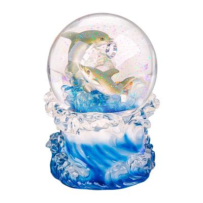 China Crystal Ball Fuse With Music Box Gift For Girlfriend Or Wife LED Color Craft Dolphin Love Theme Snow Globe Changeable Glass Swept Music Box for sale