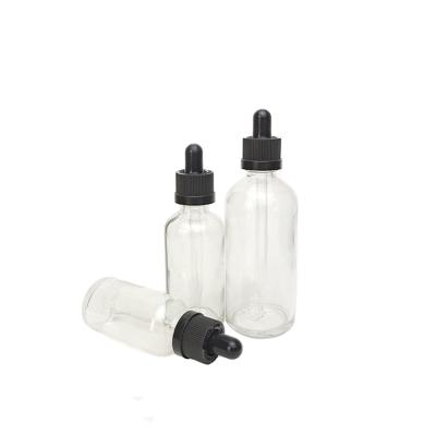 China Free Sample Cosmetic Clear Glass Essential Oil Dropper Bottle 30ml Round Liquid Dropper Bottle Black Top for sale