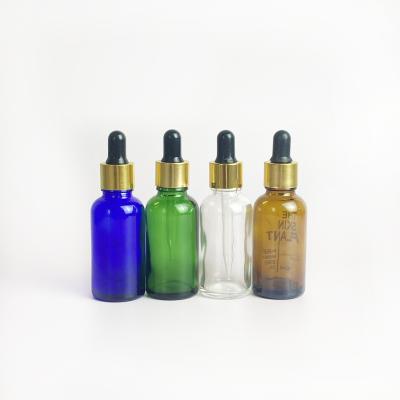 China Clear Green Amber Essential Oil Bottle 30ml Round Dropper Bottle Blue Essential Glass Packaging Euro Cosmetic Wholesale for sale