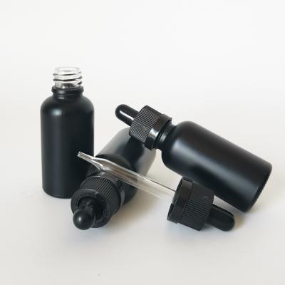 China Cosmetic Customization 30ml Matte Black Dropper Essential Oil Glass Bottle for sale