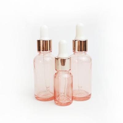 China Wholesale Cosmetic Round Rose Oil Essential Oil Bottle 15ml 30ml Dropper Bottle With Rose Gold Cap for sale