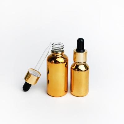 China Wholesale Price 10ml Essential Oil Bottle 20ml 30ml 50ml Gold Cylinder Shape Glass Cosmetic Dropper Bottle In Stock for sale