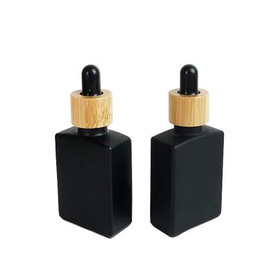 China 30ml 50ml rectangle cosmetic empty black dropper bottle frosted glass dropper bottle for sale