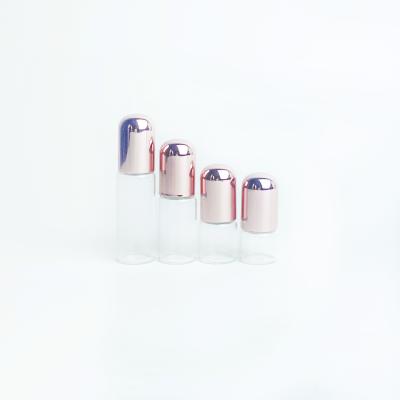 China 1ml 2ml 3ml 4ml 5ml Clear Cosmetic Round Roller Glass Bottle Rose Gold Cap Small Vial Roll On Bottle for sale