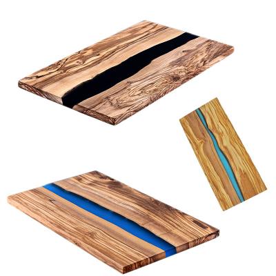 China Viable Handmade Luxury Epoxy Resin Olive Wood Chopping Board for sale