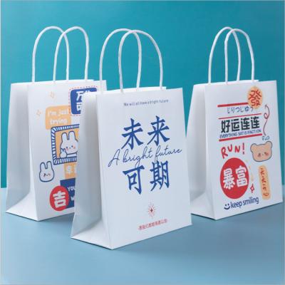 China Recyclable Cartoon Characters Writing Design Bags Eco-Friendly Wrapping Paper Tote Paper Gift Bag for sale