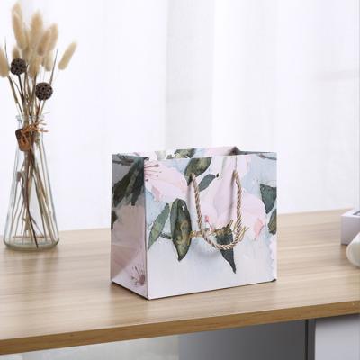 China Recyclable Custom Women Handbags Shopping Paper Bag Printed Luxury Gift Bag With Logo for sale