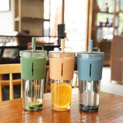 China Contemporary Food Grade ABS Glass Silicone Juice Milk Water Bottle Glass Eco Friendly Recycled Sleeve Juice Plastic Bottle With Straw for sale