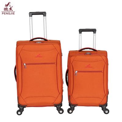 China Cotton Fabric Luxury cheap luggage bag strong orange lightweight trolley bag for sale