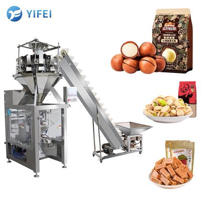 China Sealing Auto Weighing 100g Snack Candy Vertical Packing Machine Pouch Weighing Packaging Integrated Machine for sale