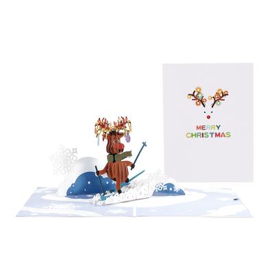 China Europe New 3D Christmas Greeting Cards Skiing Reindeer Paper Carving Message Card Handmade Creative Blessing Wholesale for sale