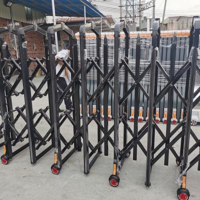 China Manual push and pull Sliding Gate Metal Manual Folding Security Barrier Black Standing Road Accordion Barrier Retractable Fence for sale